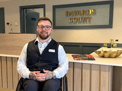 Staff member in home reception
